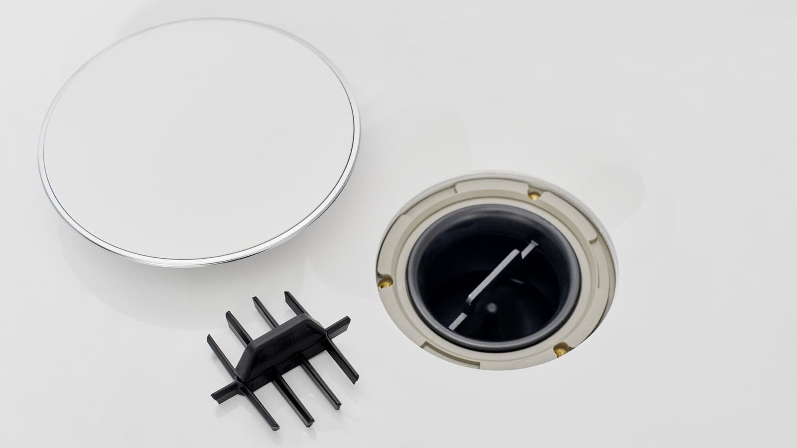 Capacul cu ventil de scurgere şi inserţia tip pieptene Capacul cu ventil de scurgere şi inserţia tip pieptene